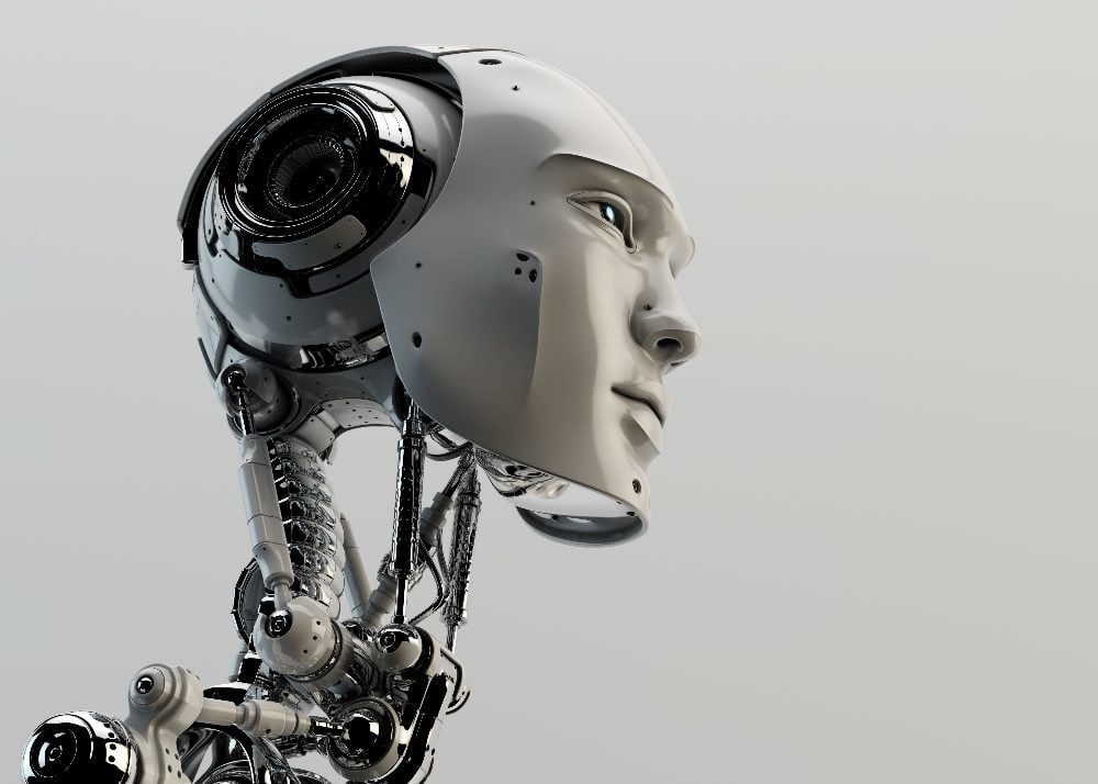 Una cabeza y cuello de cyborg con vértebras visibles y ojos azules brillantes que representan el desarrollo de la inteligencia artificial general o AGI.