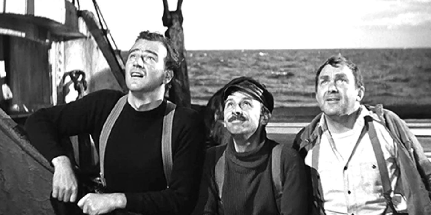 John Wayne, John Qualen y Thomas Mitchell mirando al cielo en un barco en The Long Voyage Home (1940)