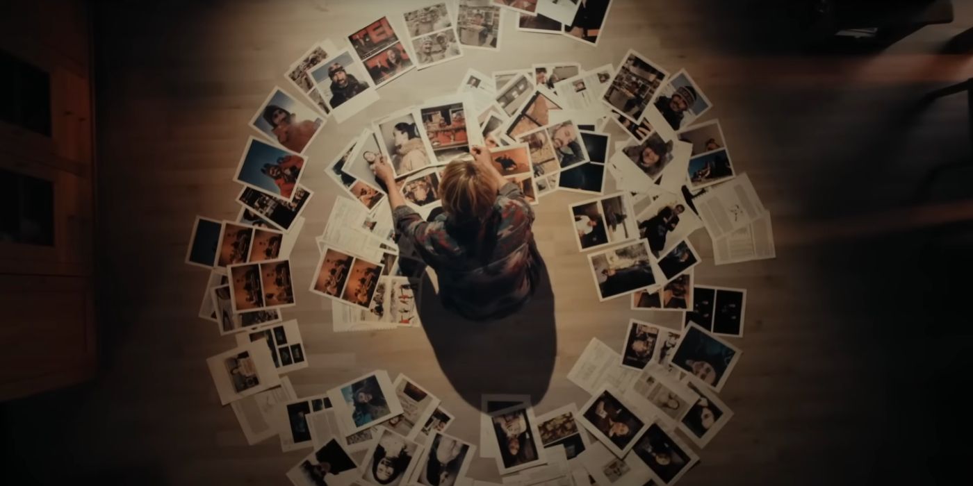 Jodie Foster's Liz Danvers kneels in the middle of a large spiral made of photographs of people in True Detective season 4