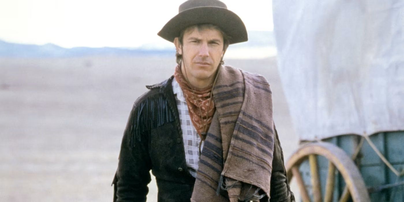 Kevin Costner as Jake, standing by a wagon with a scarf draped over his shoulder in 'Silverado'