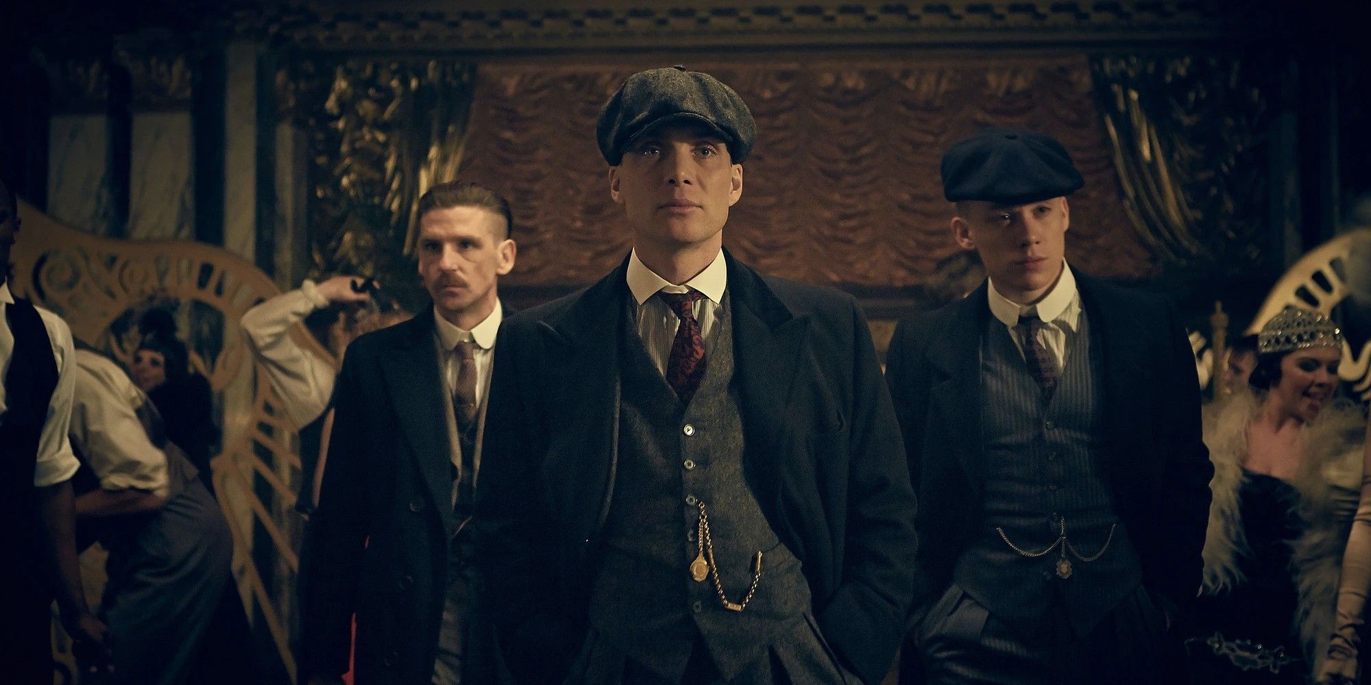 Paul Anderson, Cillian Murphy and Joe Cole walking into a party in Peaky Blinders.