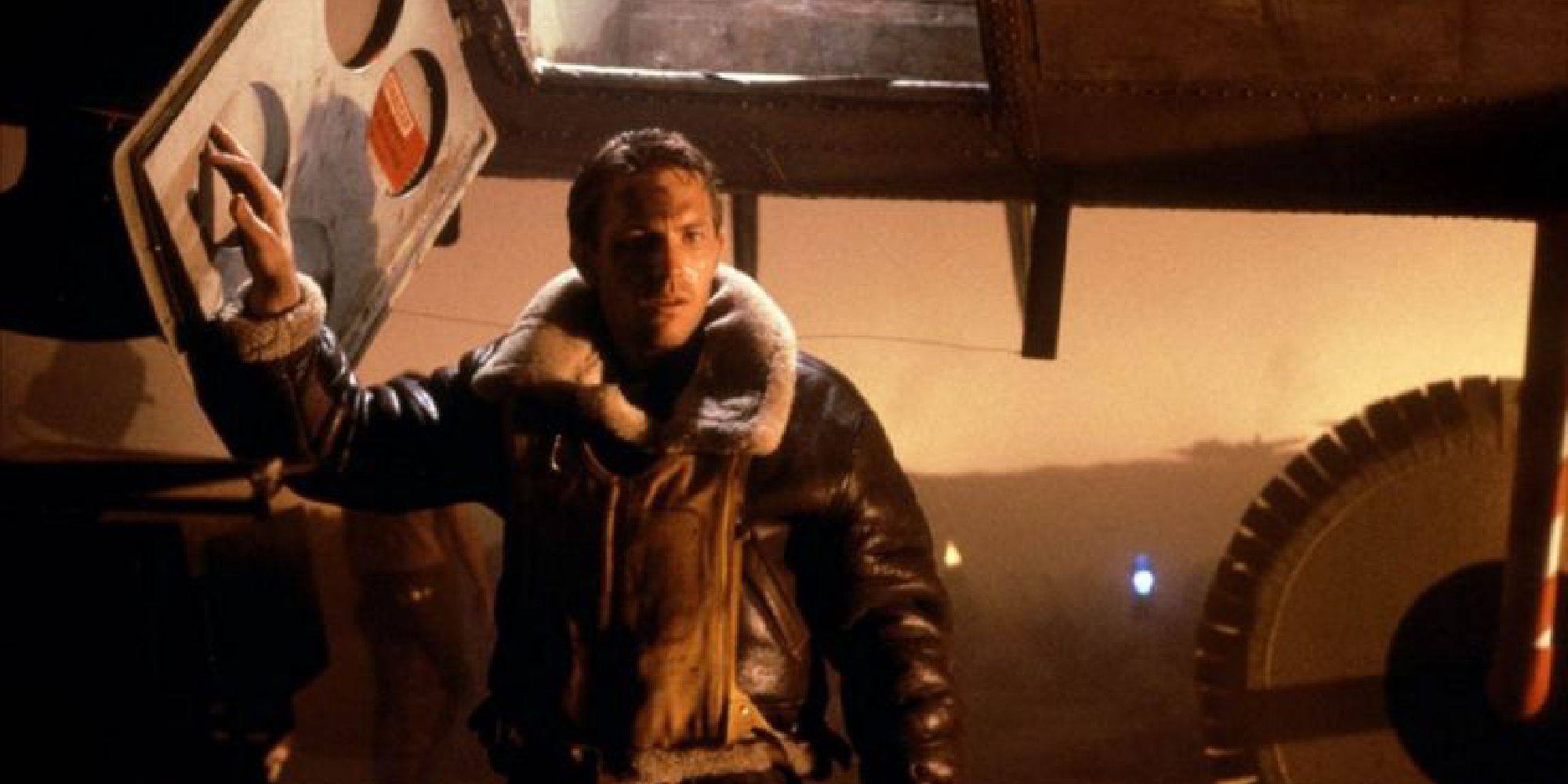 Kevin Costner as the Captain, exiting an aircraft in the Amazing Stories episode, The Mission